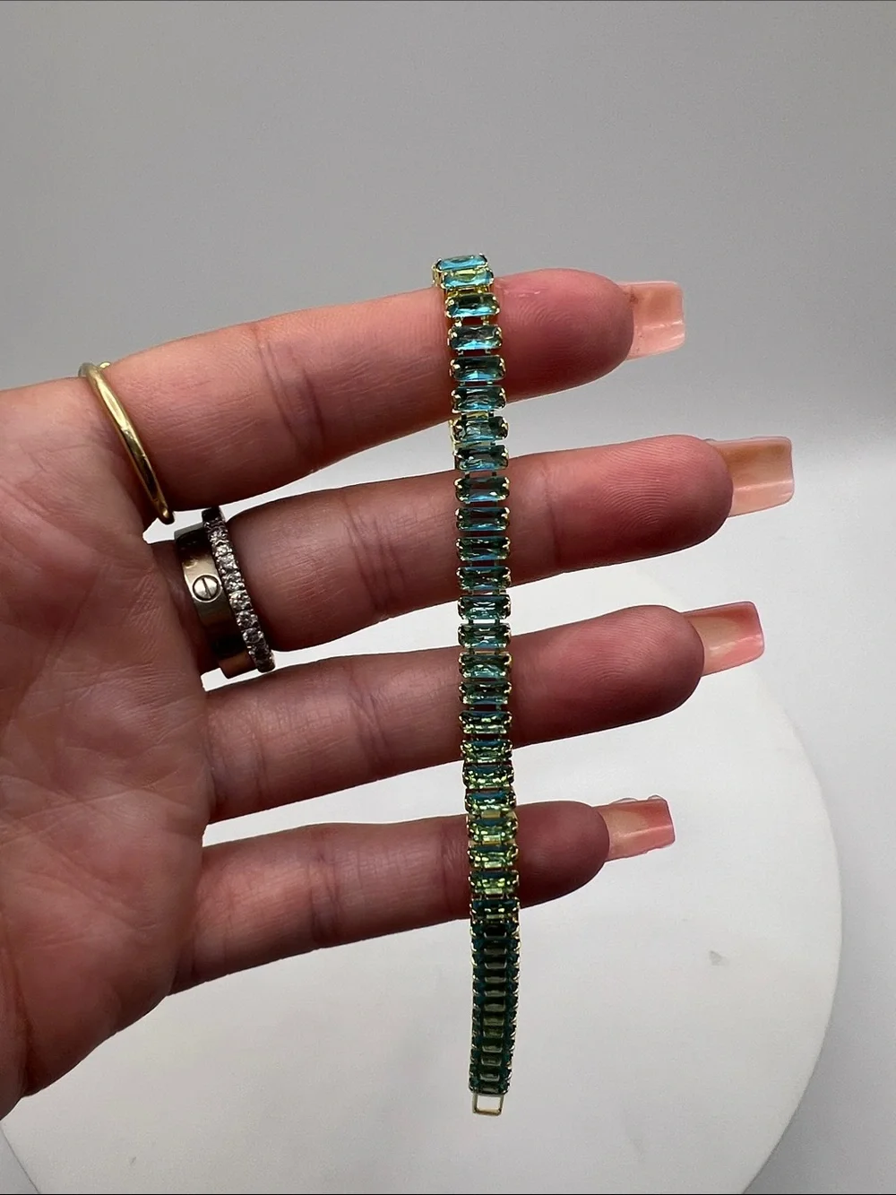 524. 18k Gold Plated over Brass Bracelet with Aquamarine Cubic Zirconias 7”